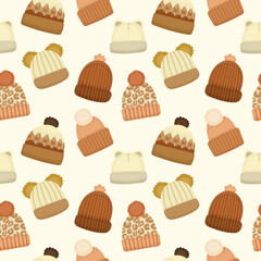Seamless pattern with warm white hats for autumn and winter in brown colors on a light background