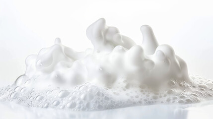 A close-up of frothy white foam, intricately detailed and texture-rich, against a simple white background.