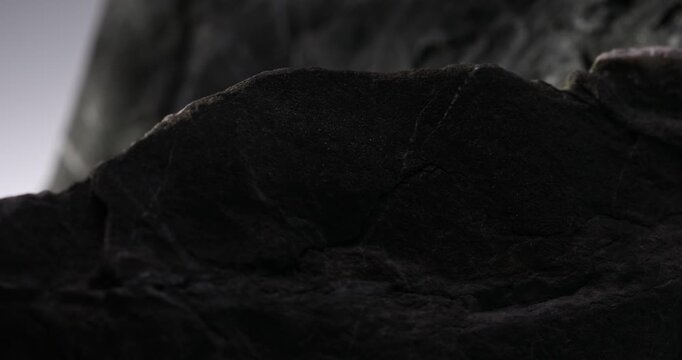 Silhouette of Textured Rock Resembling Skyline. Close-up, shallow dof.