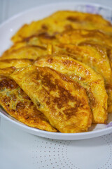 Close-up of a plate of delicious fried egg dumplings