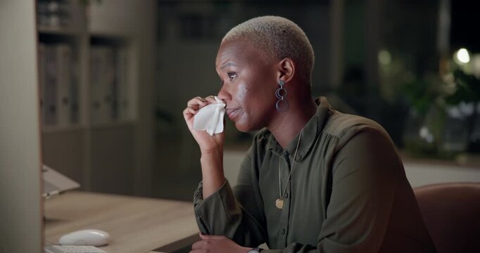Black woman, blowing nose and flu with tissue in office for viral disease, bacteria and sinus congestion. Business, person and sick with computer at night for virus, info and infection of LB.1 covid