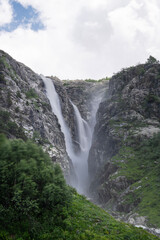 Shdugra waterfall with neighbour waterfalls near Village Mazeri, Svaneti. Expedition in Forest nearby Ushba Mountain.Shdugra waterfall near Mazeri, Georgia.
