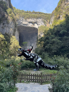 Chongqing, China - March 29 2024:  A figure of Optimus Prime riding the dinosaur autobot of the movie "Transformers 4" is on display in the Three Natural Bridges of Wulong Karst National Geology Park.