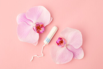 Sanitary tampon on a pink background