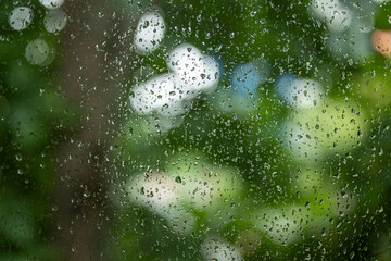 Raindrops on a wet window glass