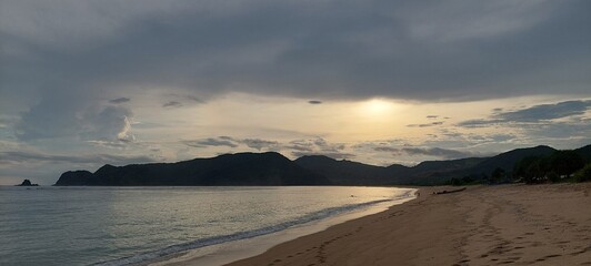 beautiful scenic background of the late afternoon sun on the beach 