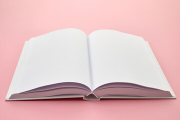Open Blank Book on Pink Background