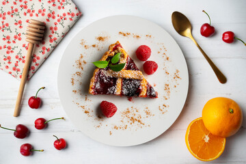 Delicious Italian crostata filled with red fruit jam.