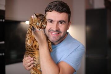 Good looking man and his exotic bengal cat