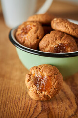 A bowl with pepas cookies on a table