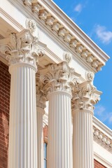 Ornate white columns and intricate architectural details of classical building facade