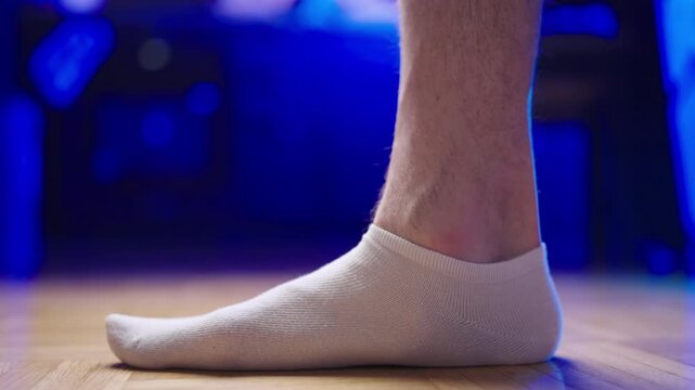 Flat feet in socks step in frame slow motion 4K