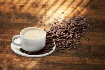 Cup of tasty hot coffee on wooden desk