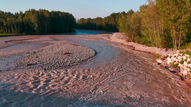 flood of the Enza river in Montecchio Emilia Italy at sunset. High quality 4k footage