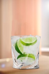 Glass with tasty cold lemonade and ice