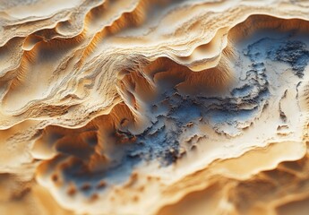 A detailed view of a sand dune landscape, focusing on the intricate patterns and shapes formed by the shifting sands