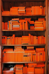 orange books on a shelf