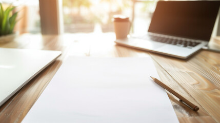 top view of Empty Resume Paper Mockup on Office Table Next to Laptop and Pencil - Vertical White Document for Business CV and Job Application Photo