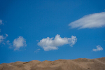 a few white clouds against a blue sky