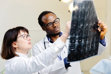 Man and woman in white lab coats conducting experiment