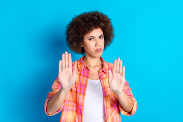 Photo portrait of attractive young woman stop gesture stretch palms dressed stylish checkered...