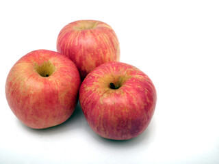 Fresh ripe red apples on white