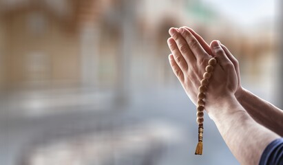 Muslim person praying on background, islamic concept