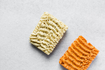 Overhead view of ramen and spicy ramen noodles, top view of noodles on countertop