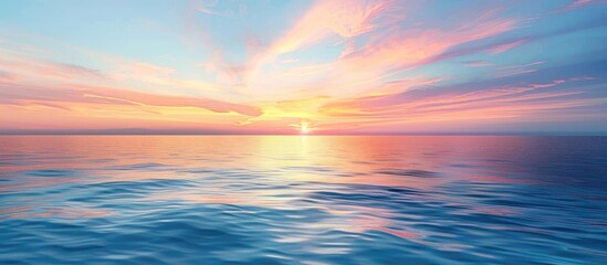 Picturesque sunset with a clear blue sky and a colorful horizon reflecting on a calm ocean seascape...