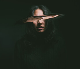 Woman, mental health or depression with blur face in studio for identity crisis, psychotic disorder...