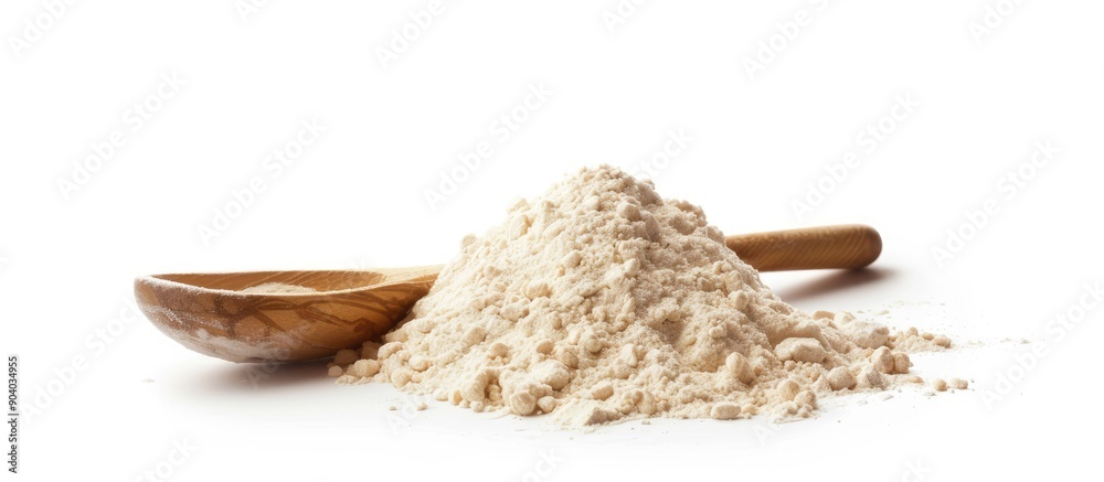 Poster a pile of wheat flour next to a wooden spoon on a white background showcasing a clear copy space ima