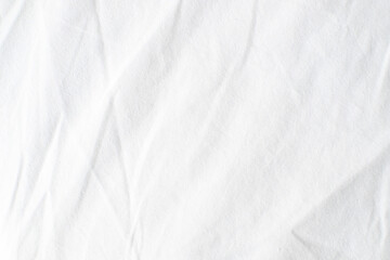 Obraz premium Abstract White Bedding Sheets or White wrinkled fabric background texture and Texture with copy-space :Creased or wrinkled white fabric,Soft focus