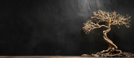 Decorative wooden tree on a black background with copy space image
