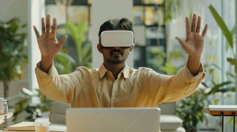 Poster indian man in vr glasses with open laptop in office. creative digital designer using 3d innovation f