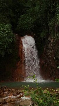 Peaceful ambient motion of water cascading in Pulang Bato waterfalls in Valencia Negros Oriental Philippines 
