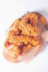 Crispy fried chicken breast strips with sauce
