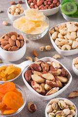 Healthy mix nuts on wooden background. Almonds, hazelnuts, cashews, peanuts, pistachios, Brazil nuts