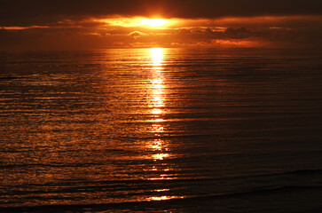 The last rays of the sun on the sea