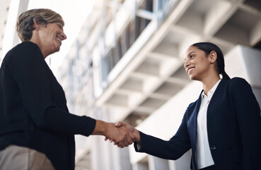 Business women, shaking hands and deal in city for meeting, partnership and greeting introduction....