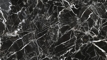 Smooth black marble texture with seamless white vein patterns for luxurious backgrounds