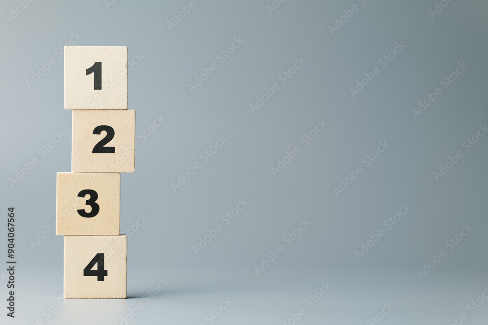 Leinwandbilder stack of thin wood blocks with orderly numbers of one, two, three, and four on gray background, meth