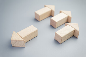 The unique arrow arranged by wood blocks has a opposite direction from the others