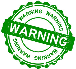 Grunge green warning word round rubber seal stamp on white background