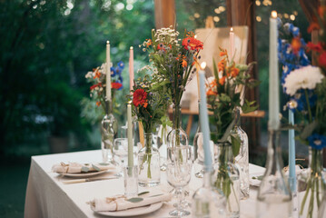 Decorated atmospheric table for a conservatory wedding. The concept of serving and decorating the holiday