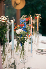Decorated atmospheric table for a conservatory wedding. The concept of serving and decorating the holiday