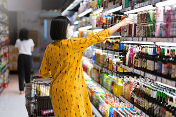 Portrait of Woman shopping in the supermarket.