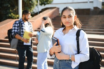 Cheerful Indian asian young group of college students or friends together