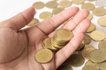 Little money in hand Asian women, gold Thai baht, low savings, bad economy concept.