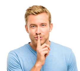 Secret, portrait and man with finger on mouth for gossip, silence and confidential announcement in studio. Privacy, voice and face of male person with news, whisper and censorship on white background