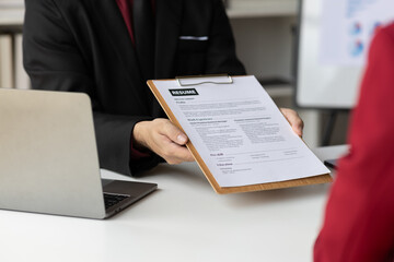 Job searching, Applicants submit application documents and resumes during job interviews in the office. Job interview